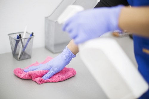 Commercial cleaners working in a Surrey office reception area