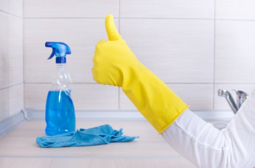 Post-construction cleaning of a Surrey kitchen with surfaces and fixtures being detailed