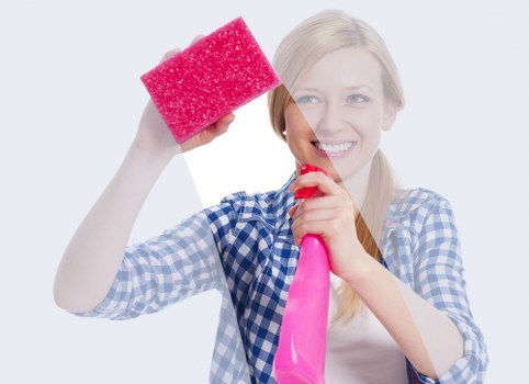 Cleaner maintaining a flat in Surrey with attention to surfaces and floors